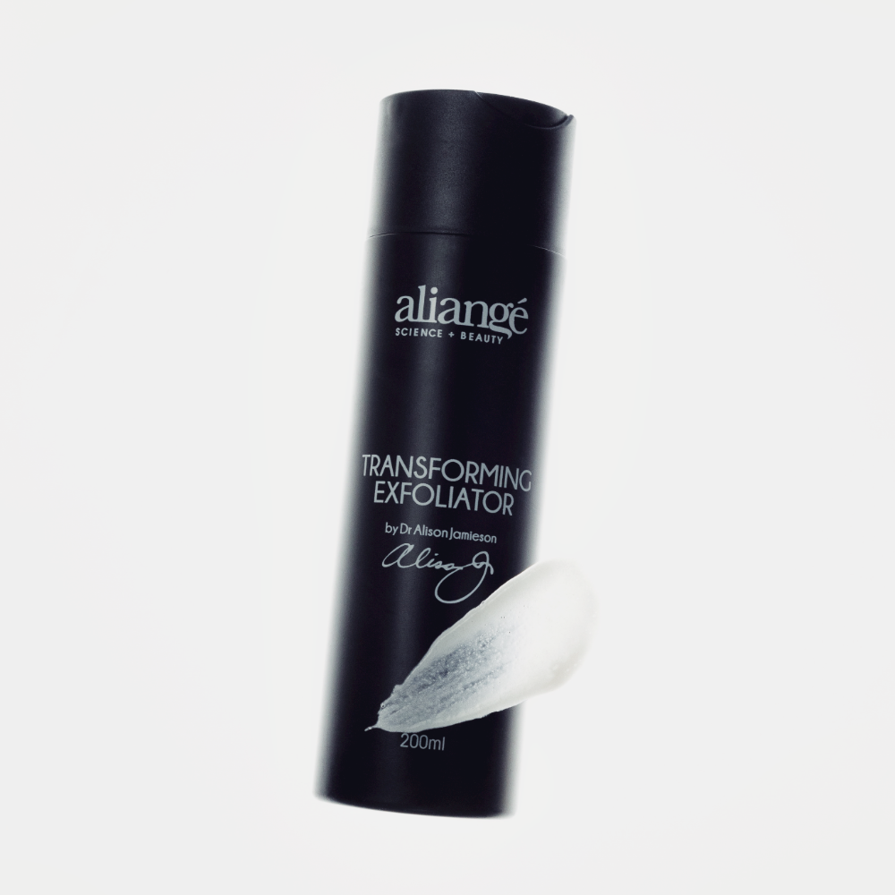 Aliangé Transforming Exfoliator 200ml tilted with a granular cream swatch — AHA and tea tree wash