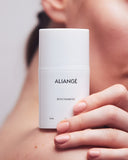 Woman applying Aliangé Biocinamide — niacinamide barrier serum in use