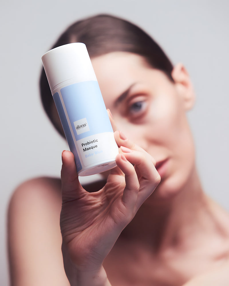 Woman applying Aliangé Probiotic Masque — probiotic microbiome treatment in use