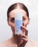 Woman applying Aliangé Probiotic Masque — probiotic microbiome treatment in use