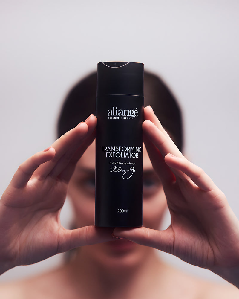 Woman using Aliangé Transforming Exfoliator — AHA tea tree resurfacing wash in use