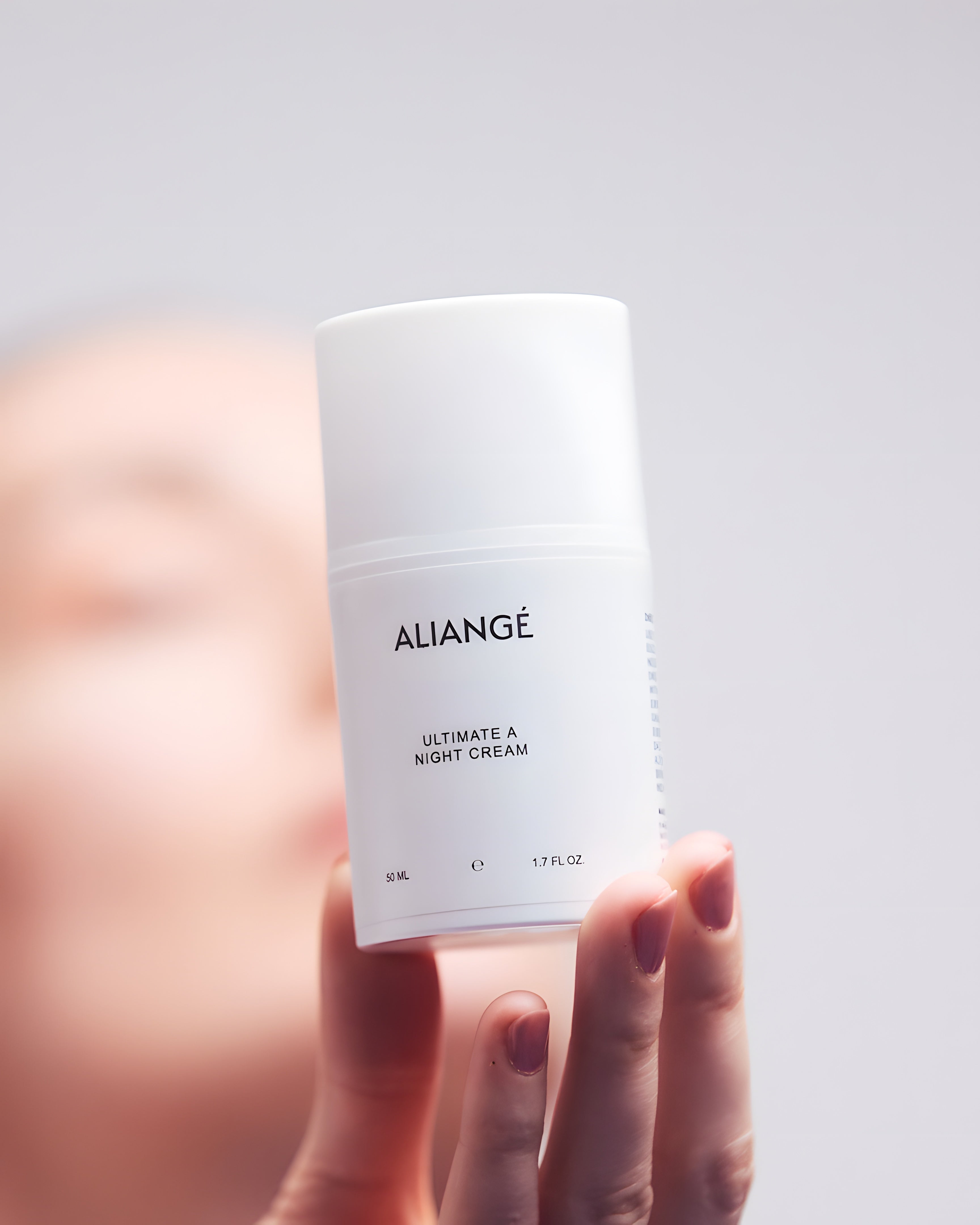 Woman applying Aliangé Ultimate A Night Cream + — retinol bakuchiol night ritual in use